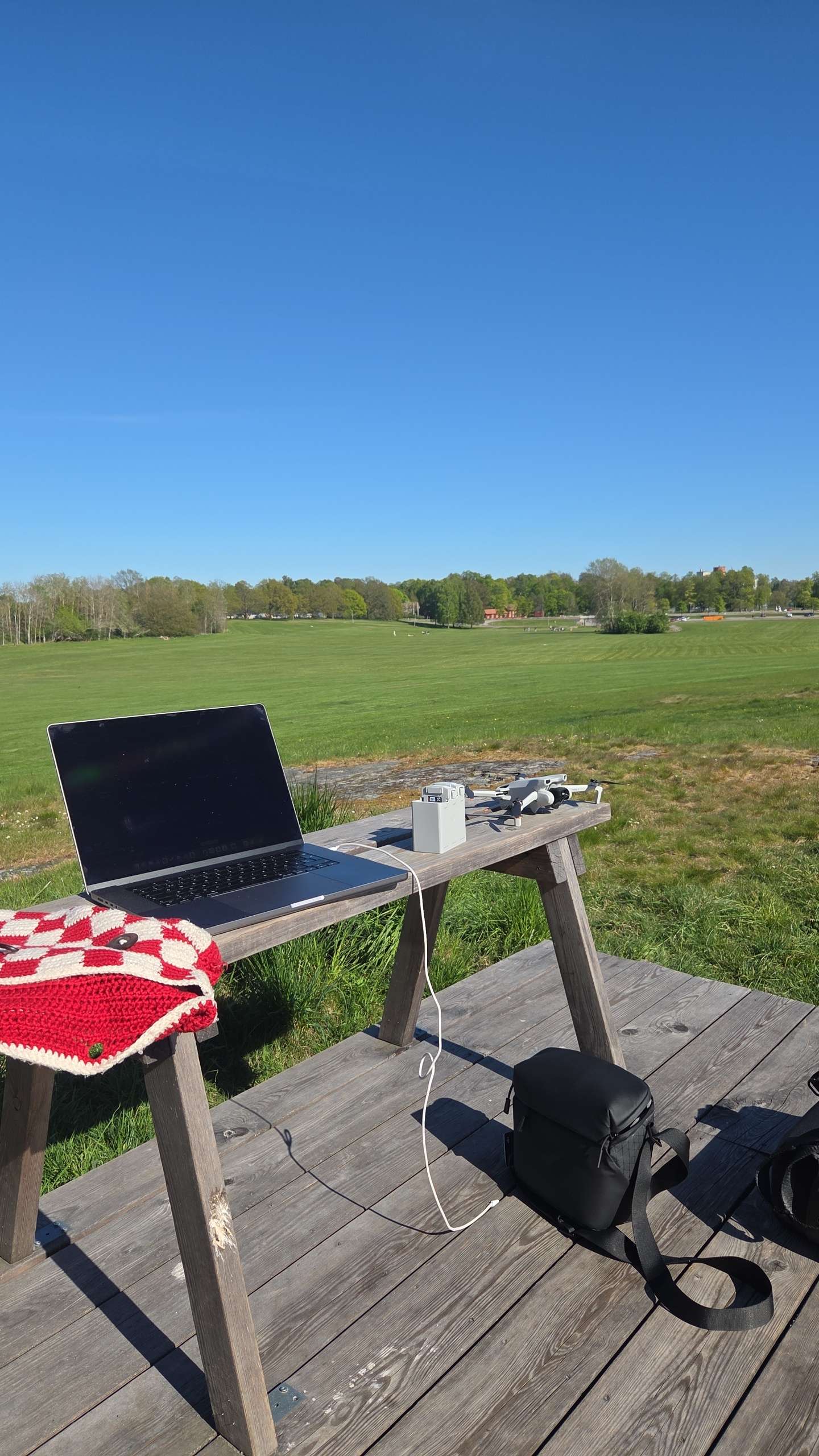 Outdoor field test setup with drone and laptop